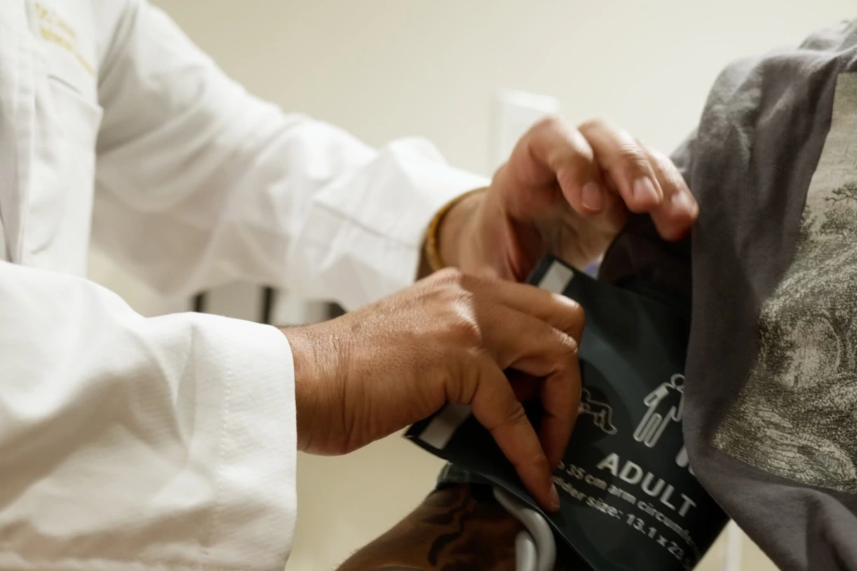 Physician checking a patient's blood pressure at Renova Total Health