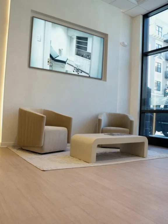 Bright lounge area with armchairs at Renova Total Health in Carmel, Indiana