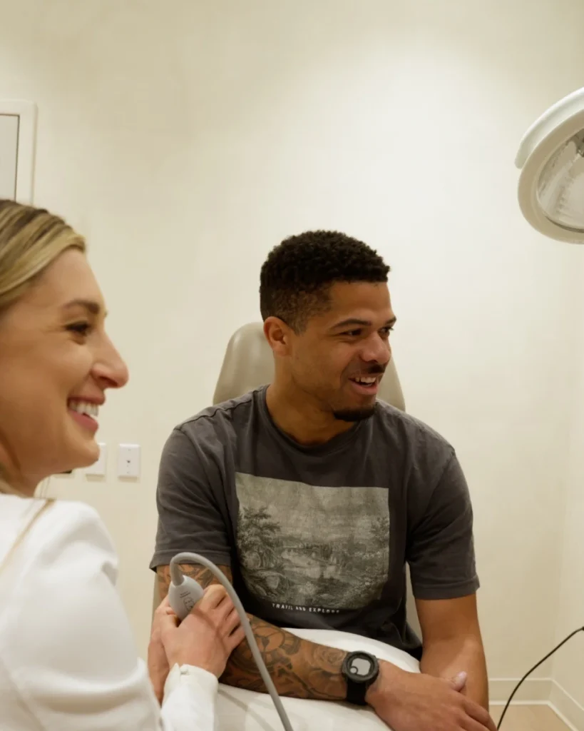 Smiling provider and patient during a relaxed follow-up visit at Renova Total Health