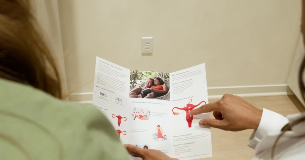 Renova Total Health provider walking a patient through a women's health brochure in Carmel, Indiana